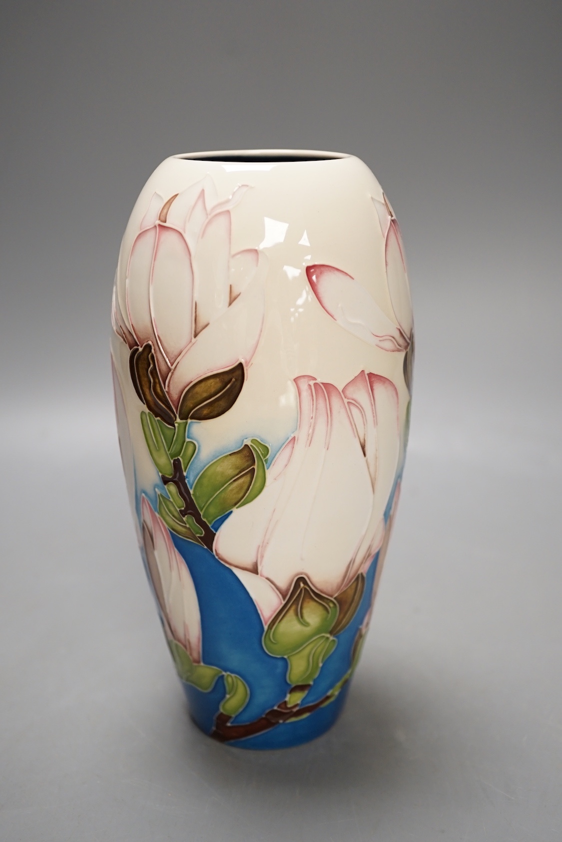 A Moorcroft 'sunshine magnolia' vase by Paul Hilditch, limited edition 10/100, 2011, boxed, 18.5 cms high.